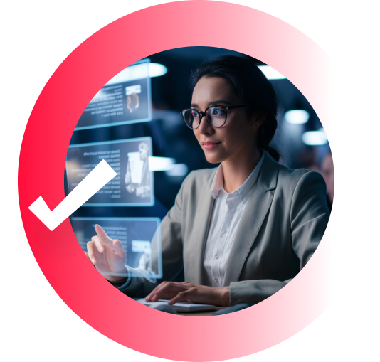 A woman wearing glasses and a grey blazer, smiling while scrolling through a hologram.