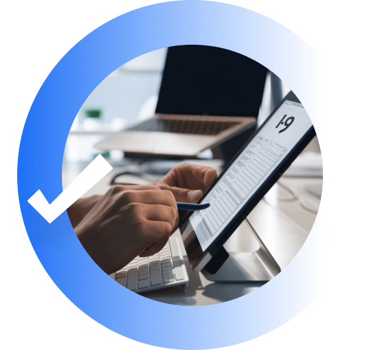 A person scrolling through an I-9 form on a propped up tablet.