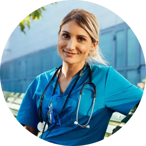 A woman in scrubs smiling
