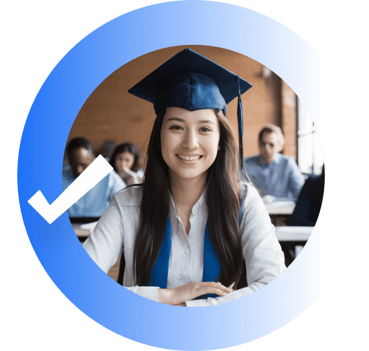 smiling student wearing a graduation cap sitting in a classroom inside a blue circle with a checkmark